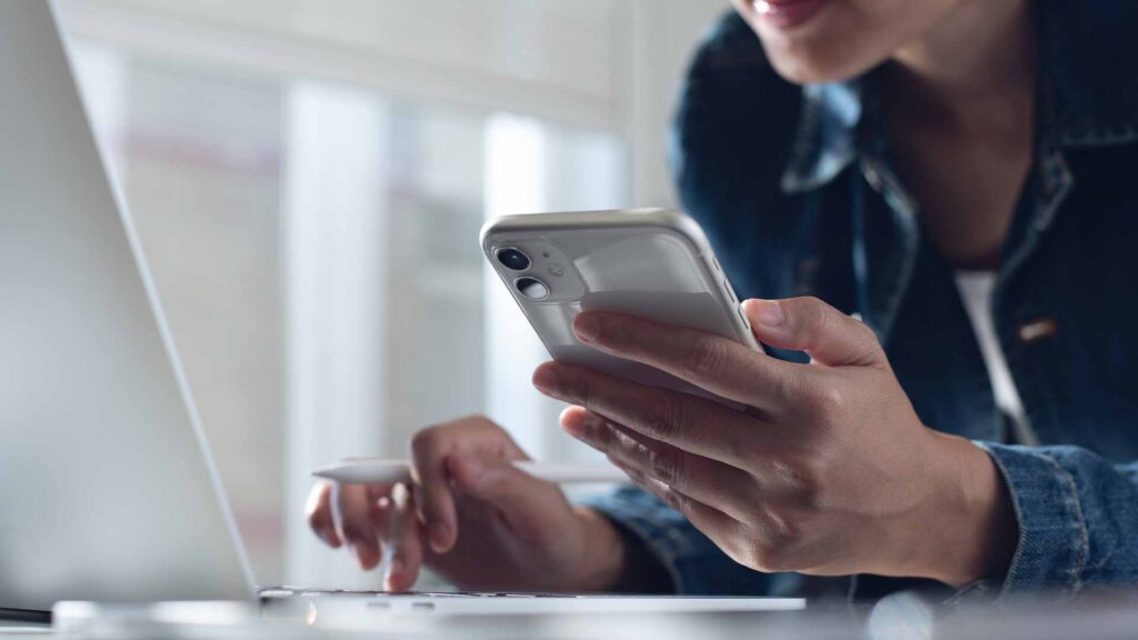Woman searching on her laptop and contacting the rehab admissions team at Rockland Recovery Group.